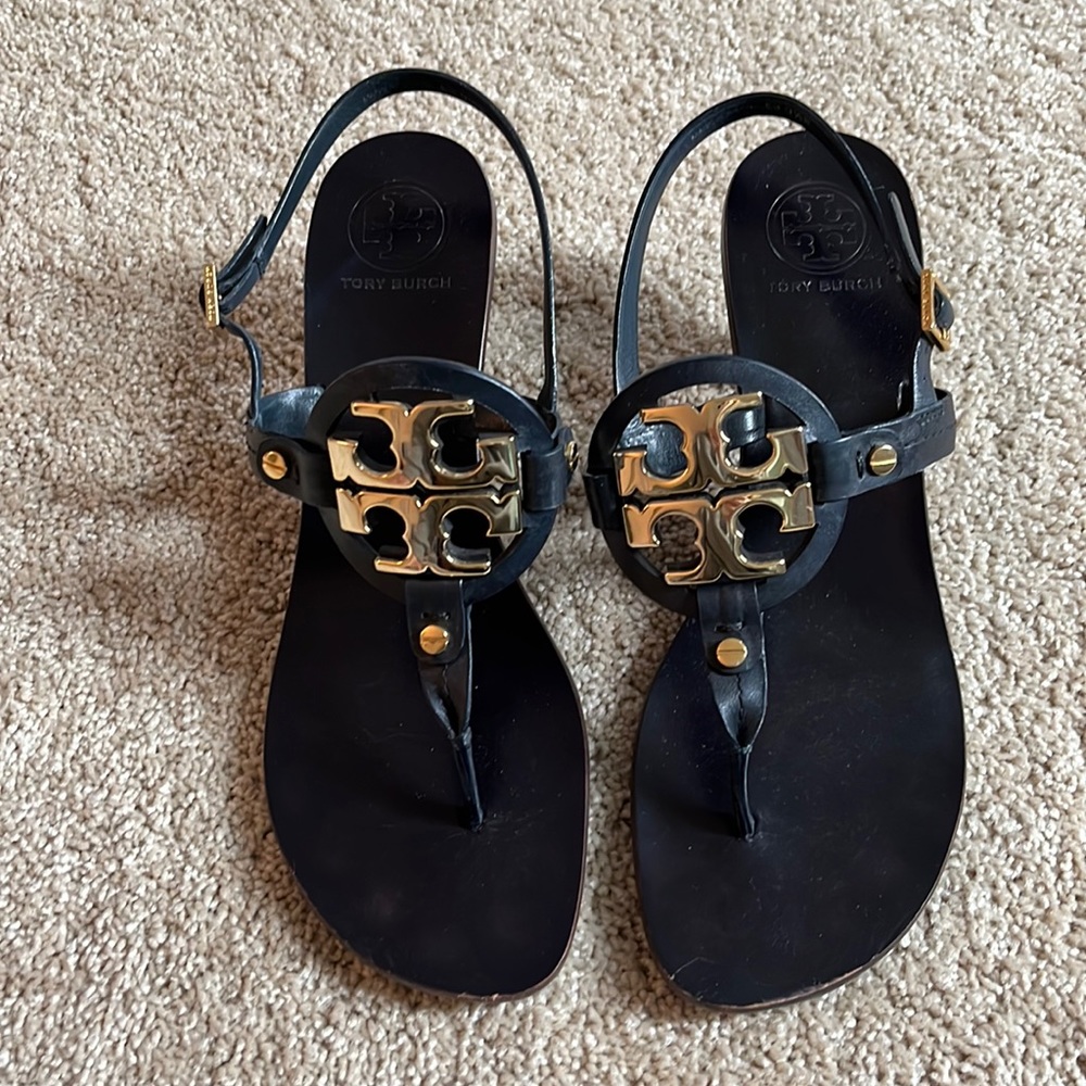 Tory Burch navy blue leather sandal with gold logo and wooden stacked 3” heel.